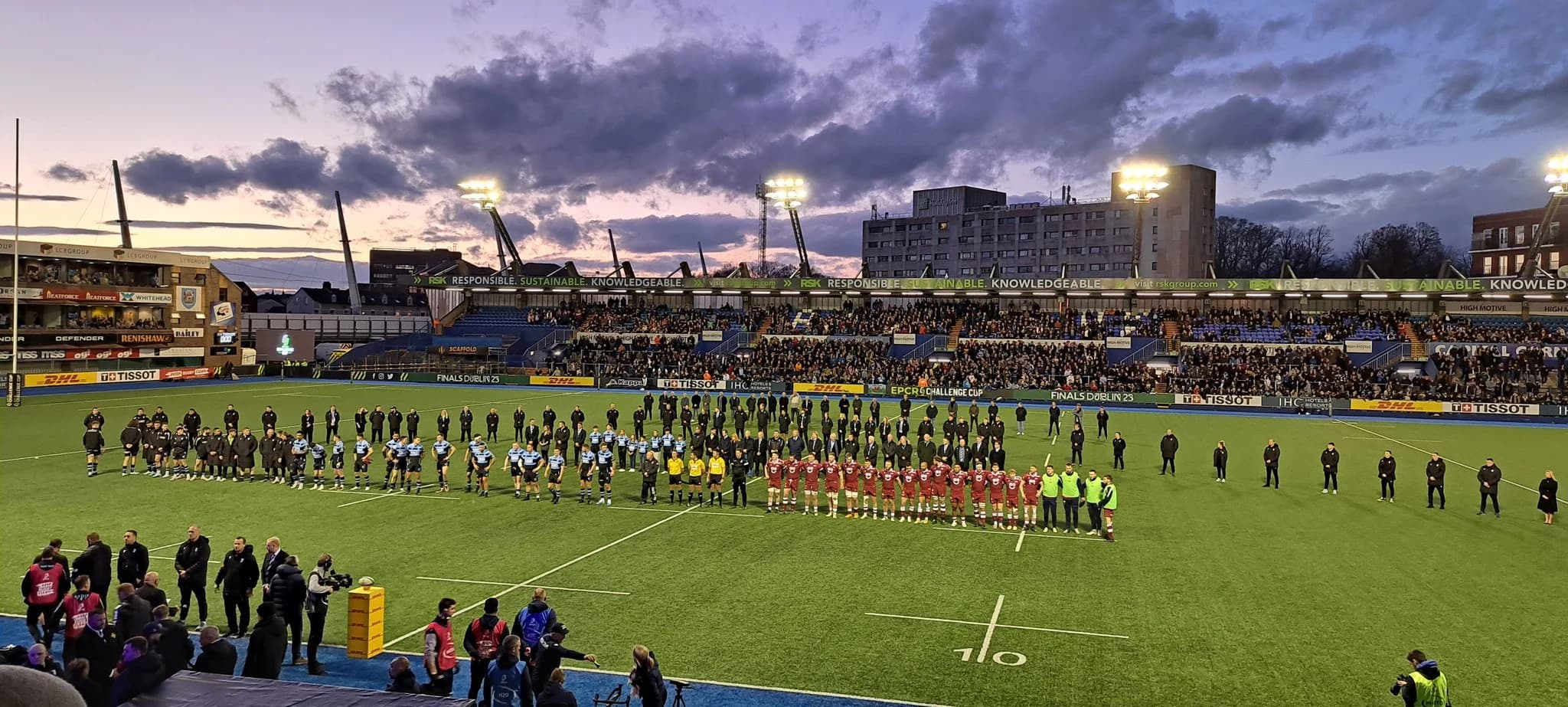Players, officials and staff pay tribute to Peter Thomas at Cardiff Arms Park. Pic: Sal Carter, CF10 Rugby Trust.